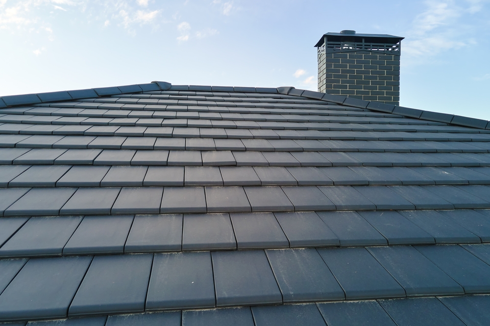 Closeup,Of,House,Roof,Top,Covered,With,Ceramic,Shingles.,Tiled